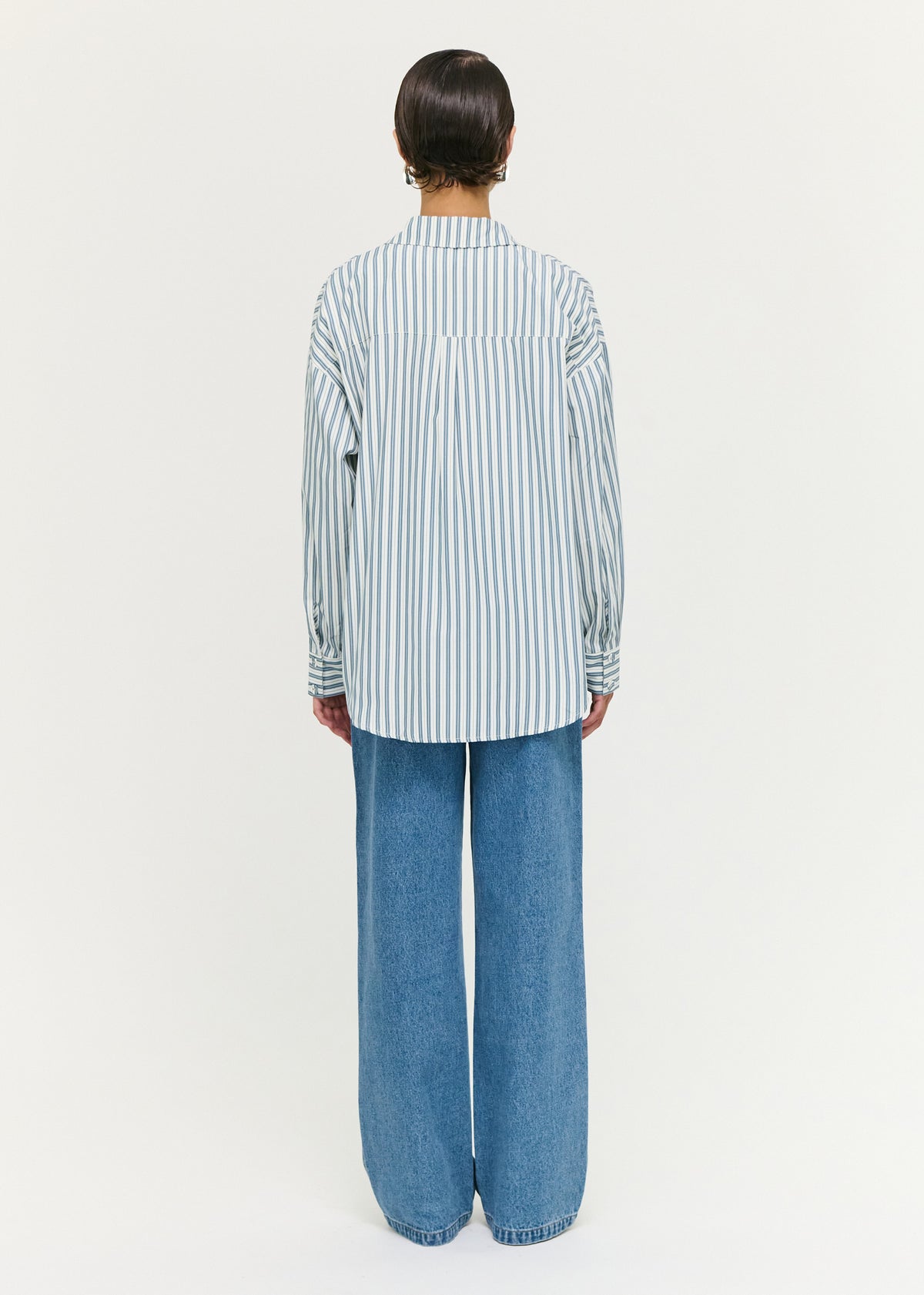 Back view of the Tie Waist Detail Mid Rise Jeans with an adjustable waist tie detail.