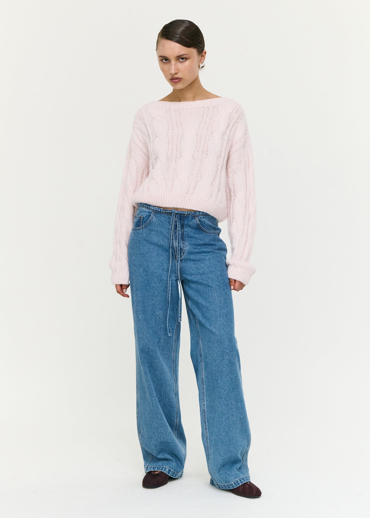 Model wearing Tie Waist Detail Mid Rise Jeans, showing a full-length design and a relaxed straight-leg silhouette.