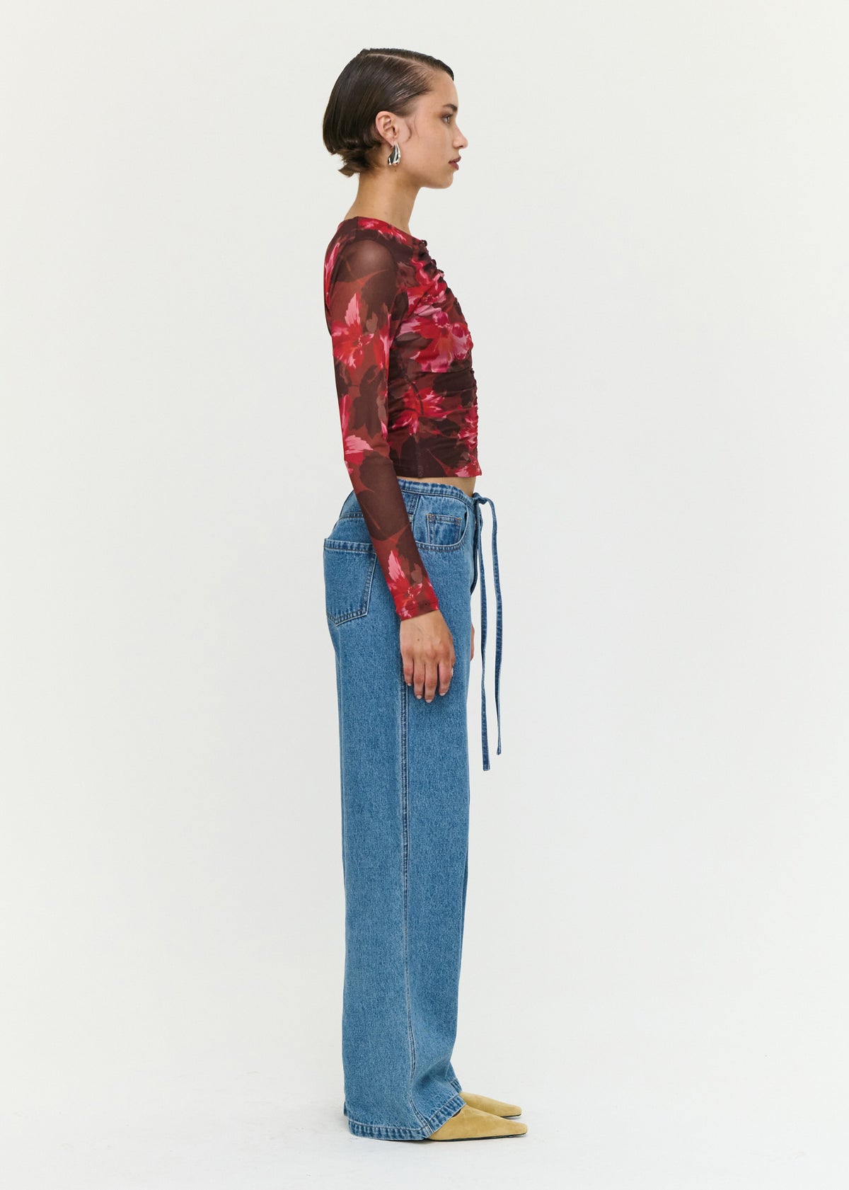 Side view of the Tie Waist Detail Mid Rise Jeans, showing a relaxed straight-leg silhouette and a full-length design.