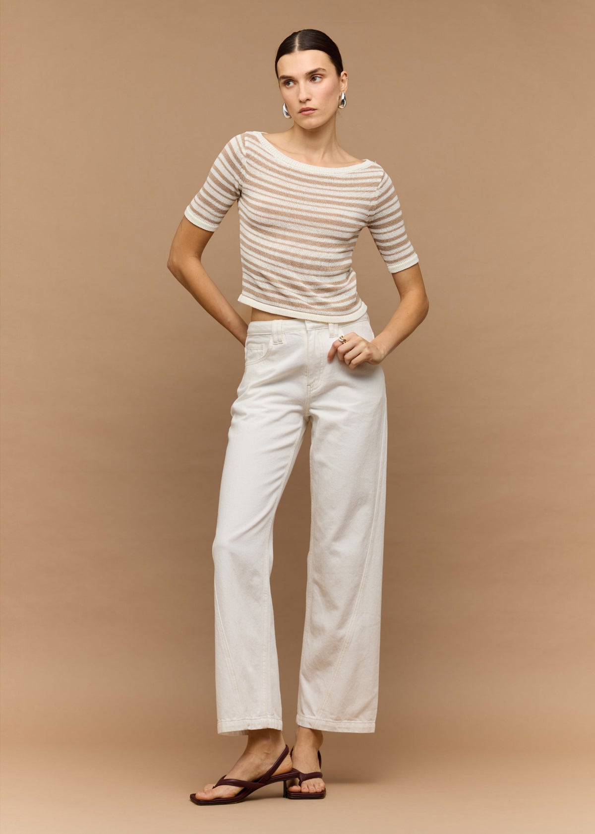 Model wearing White Denim Mid-Rise Straight Jeans, showing a straight-leg fit and a classic 5-pocket design.