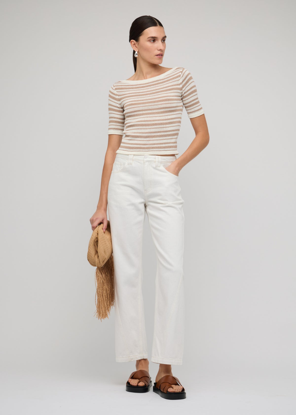 Model wearing White Denim Mid-Rise Straight Jeans, showing a classic 5-pocket design.