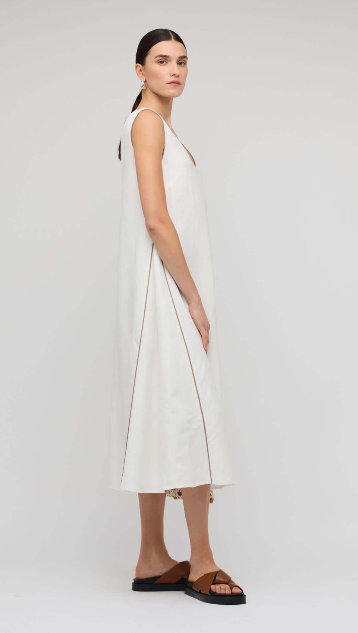 White Godet Linen Midi Dress featuring a sleeveless design and flattering V-neckline, perfect for summer occasions.