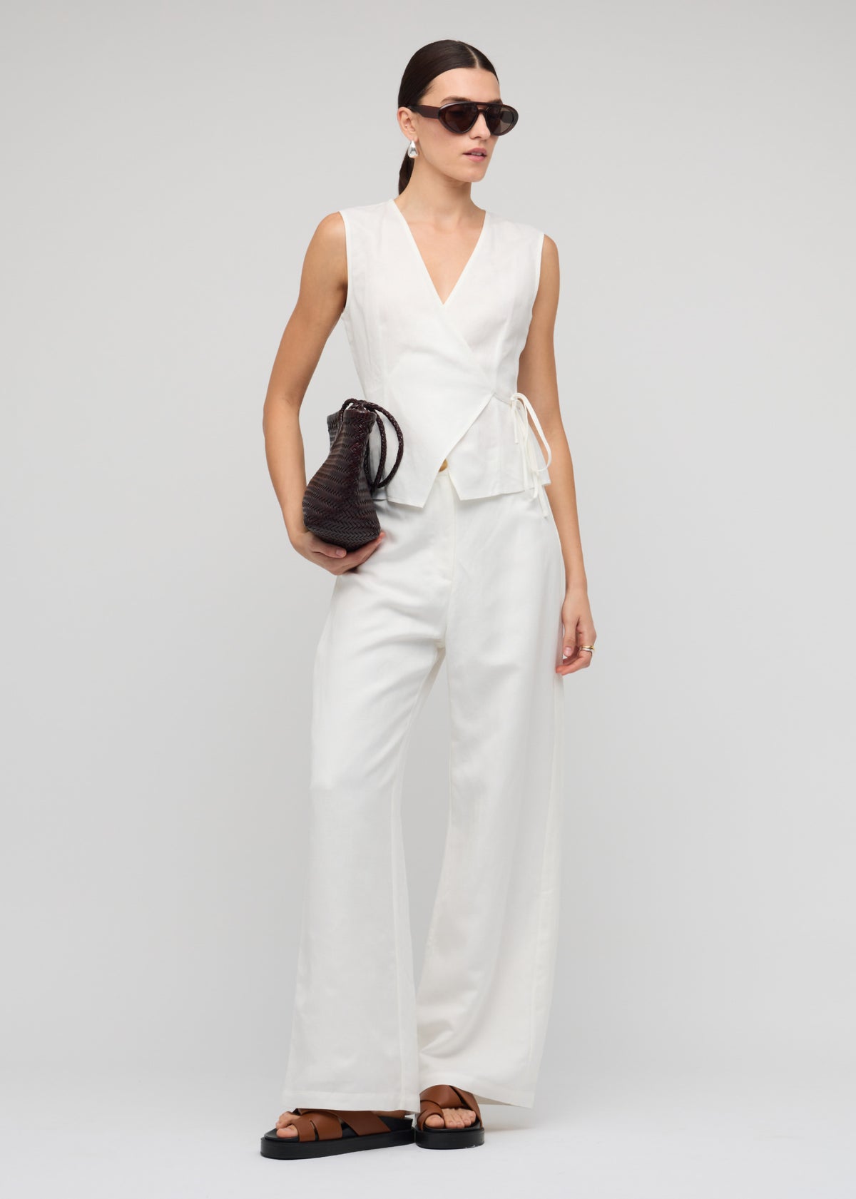 Model wearing White Linen Wide Leg Pants with a crisp white shade and a high-waisted fit.