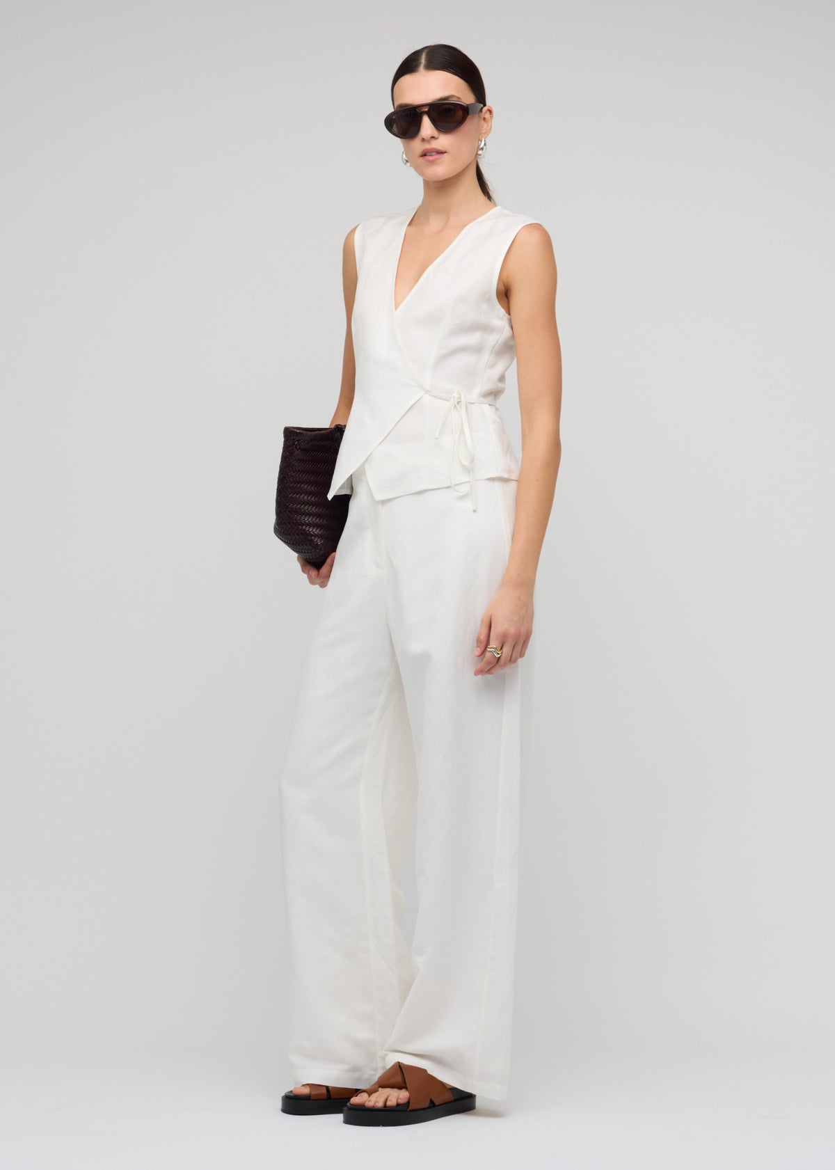 Angled view of the White Linen Wide Leg Pants with a crisp white shade and a high-waisted fit.