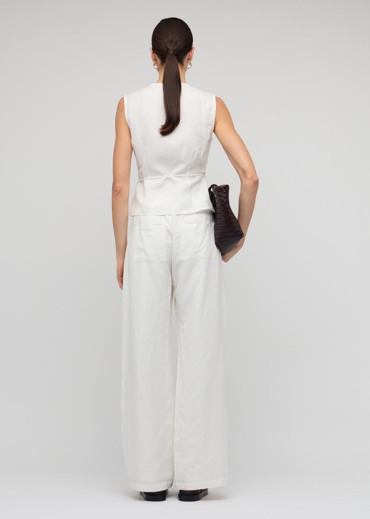 Back view of the White Linen Wide Leg Pants with a crisp white shade and a high-waisted fit.