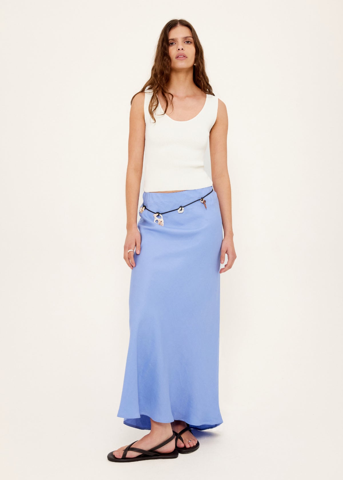 Model wearing White Reversible Knit Tank Top, showing a fitted rib knit silhouette and a lightweight, stretchy fabric.