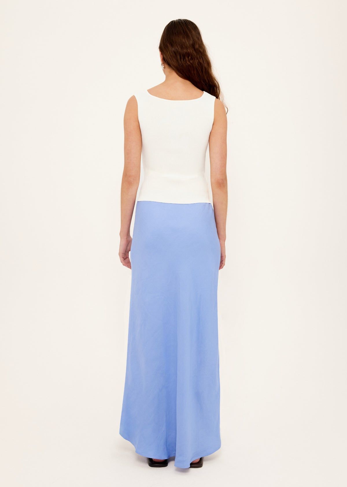 Back view of the White Reversible Knit Tank Top with a reversible design: wear and a fitted rib knit silhouette.