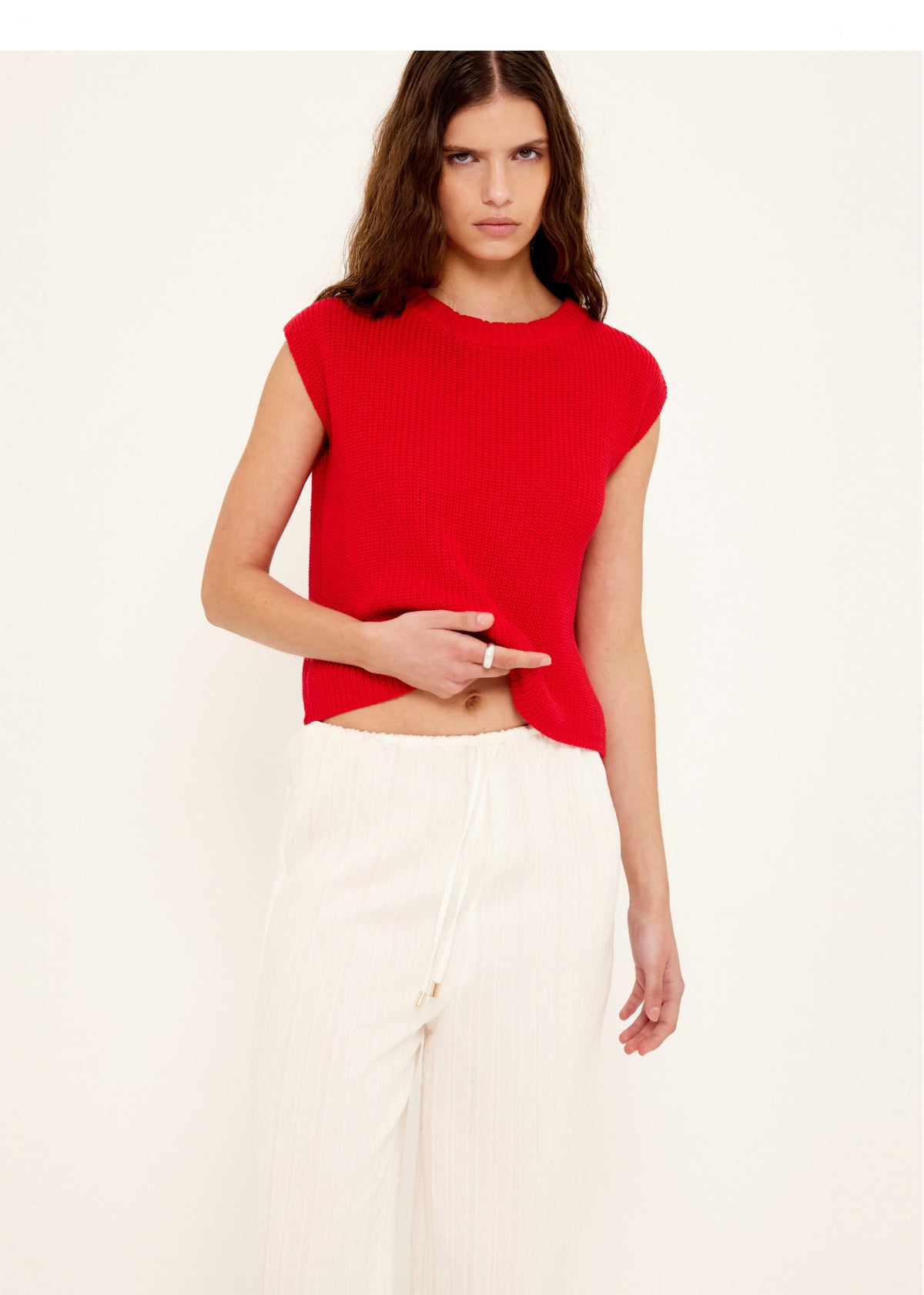 Close-up of White Wide Leg Drawstring Pants with an elasticated waistband with drawstring tie and a relaxed wide-leg silhouette.